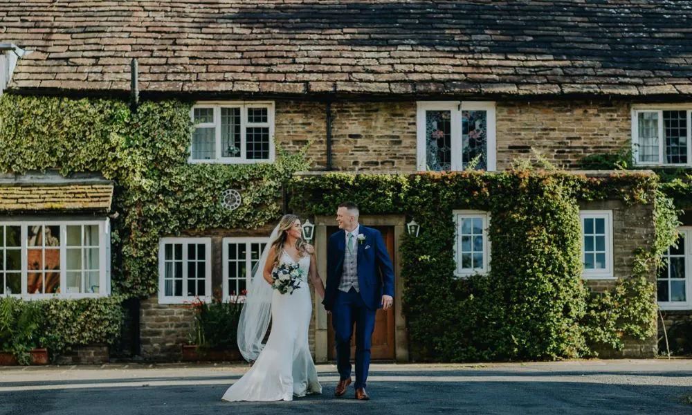 a couple on their wedding day outside of Hilltop Country House