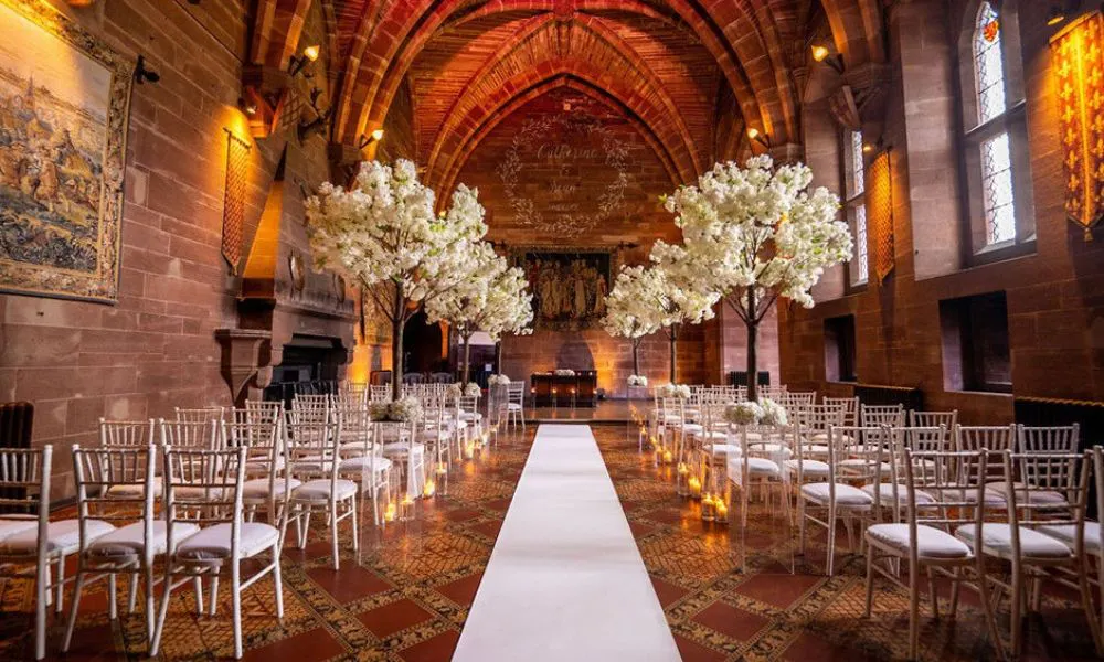 a wedding ceremony set up inside a chapel