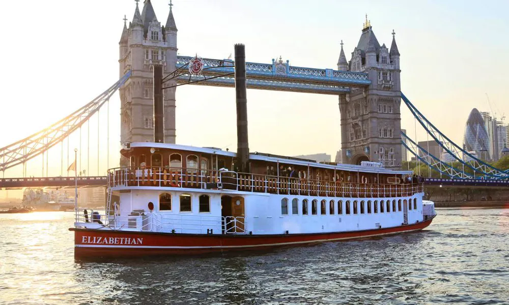 a boat sailing down the river thames