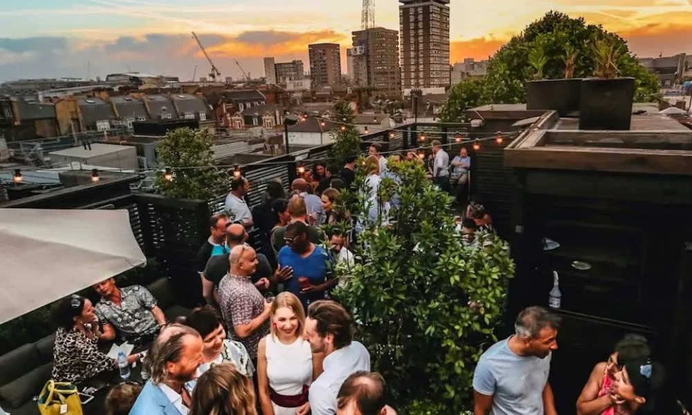 people gathering on a london rooftop