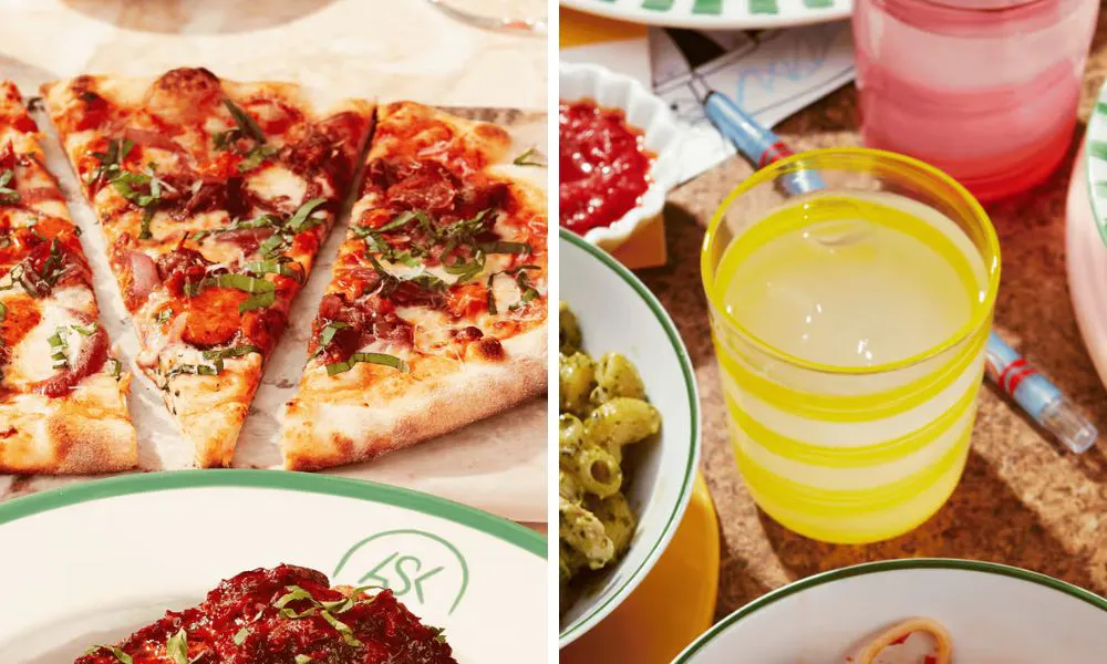 pizza slices on a sharing board and lemonade in a yellow glass