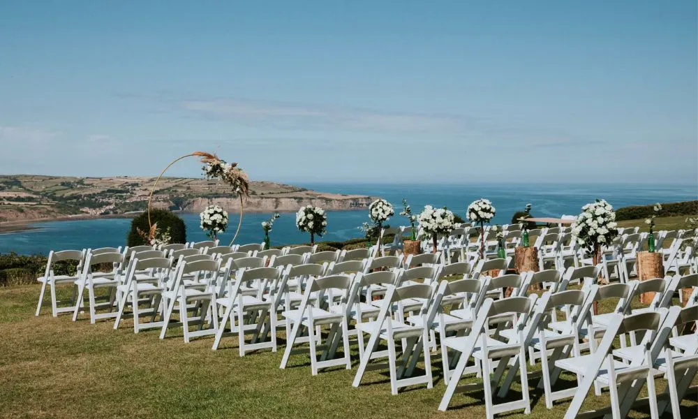 a wedding ceremony set up by the sea