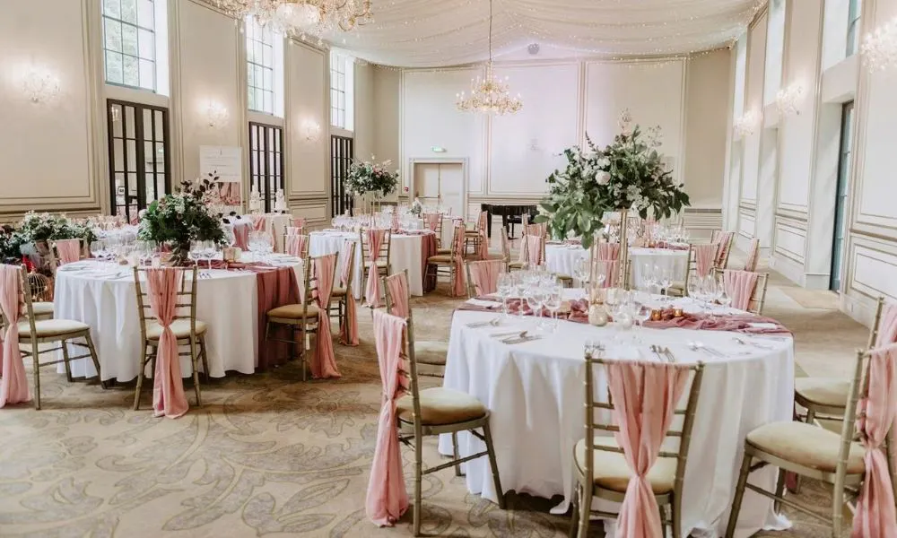 a pink, floral wedding breakfast set up