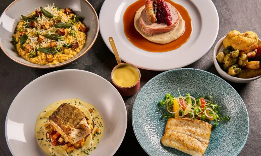 an aerial shot of festive dishes such as turkey ballotine and cod pave