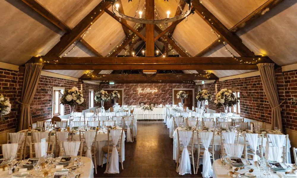 a wedding breakfast set up in a barn