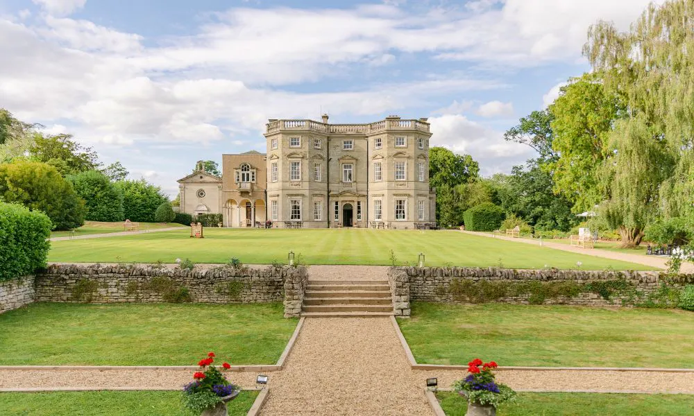 a country house surrounding by manicured lawns