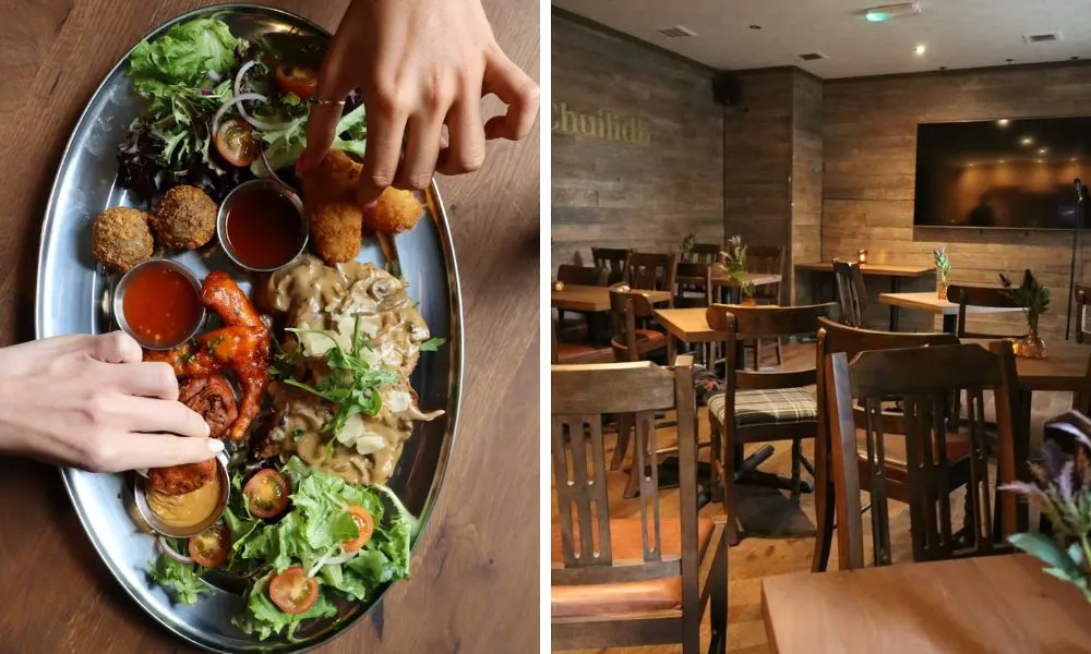 sharing platter of snacks and dining room with wooden tables and chairs