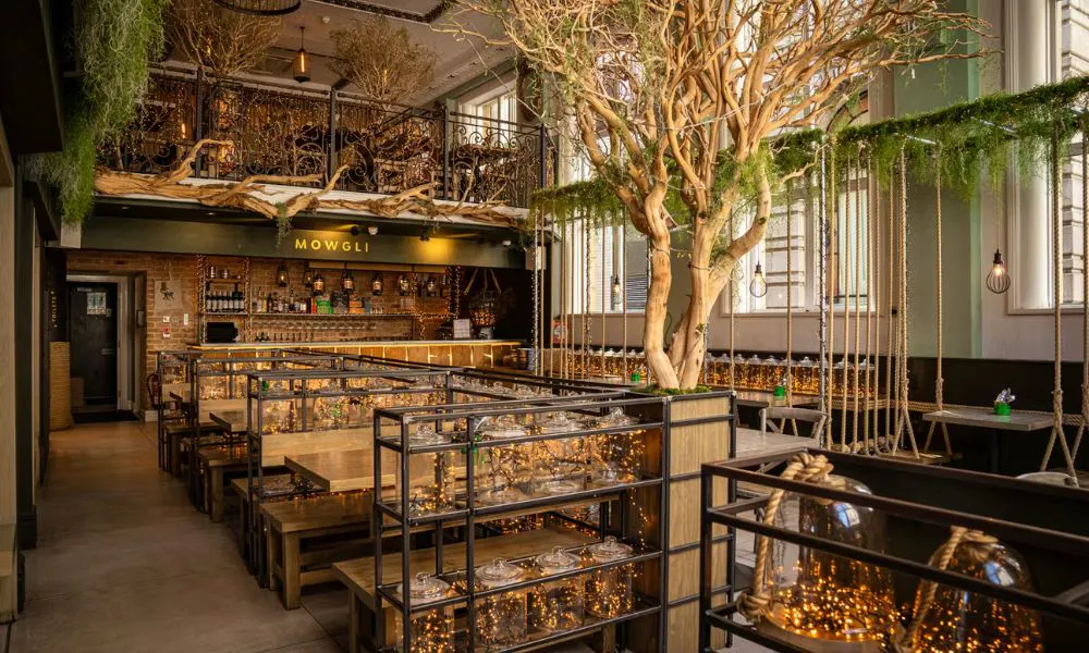 casual resaurant interiors with lots of foliage at Mowgli
