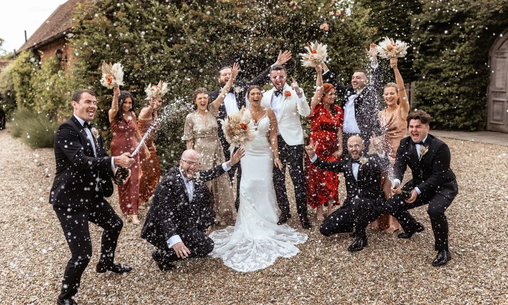 Wedding party celebrating with champagne