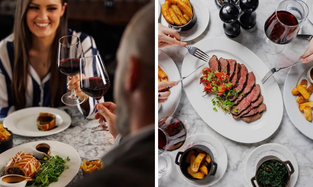 couple with glasses of red wine and steak with handcut chips