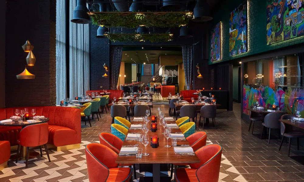 modern restaurant with colourful bucket chairs