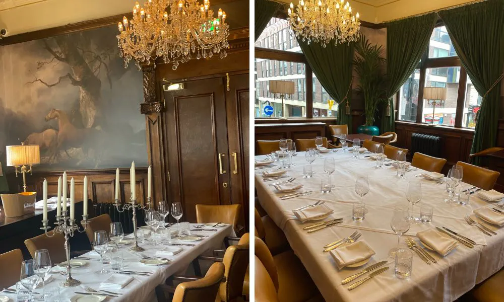 long banquet table with white tablecloth and chandelier