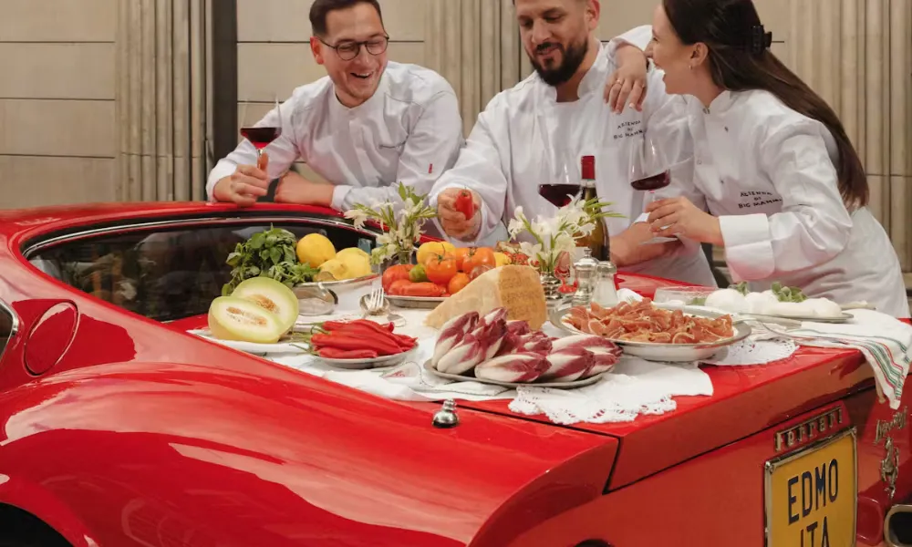 edmondo team eating off a ferrari