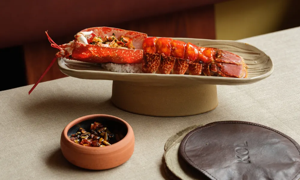 Fine dining mexican lobster dish on a pedestal dish