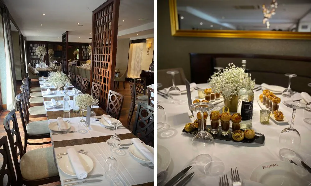 a neutral restaurant with wooden features, white clothed tables and an elegant feel