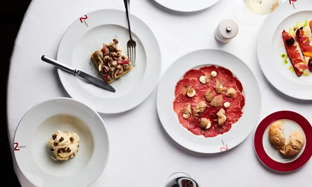 white table with carpaccio and starters