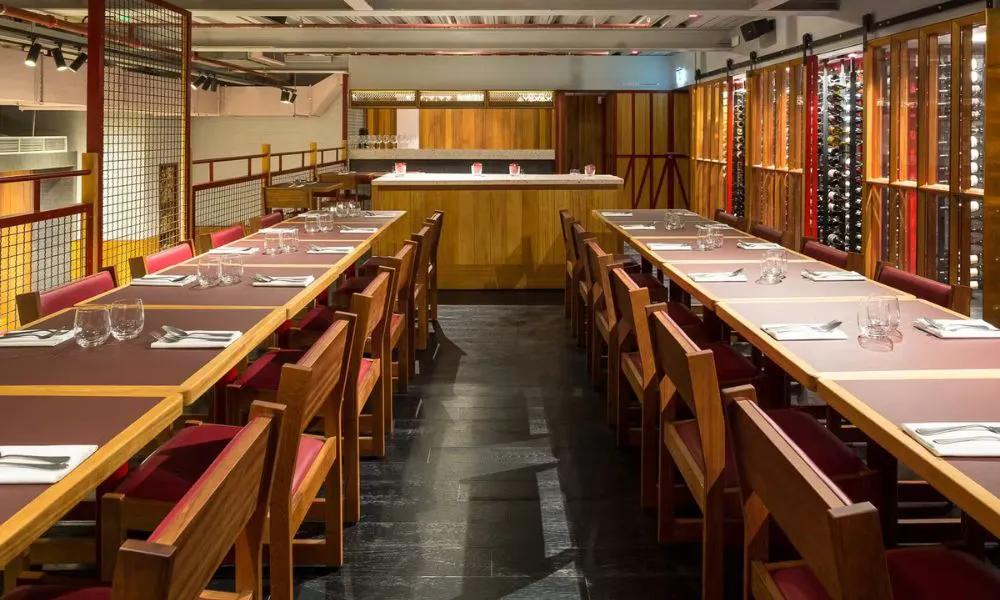 mezzanine private dining space with wine cellar and banquet tables