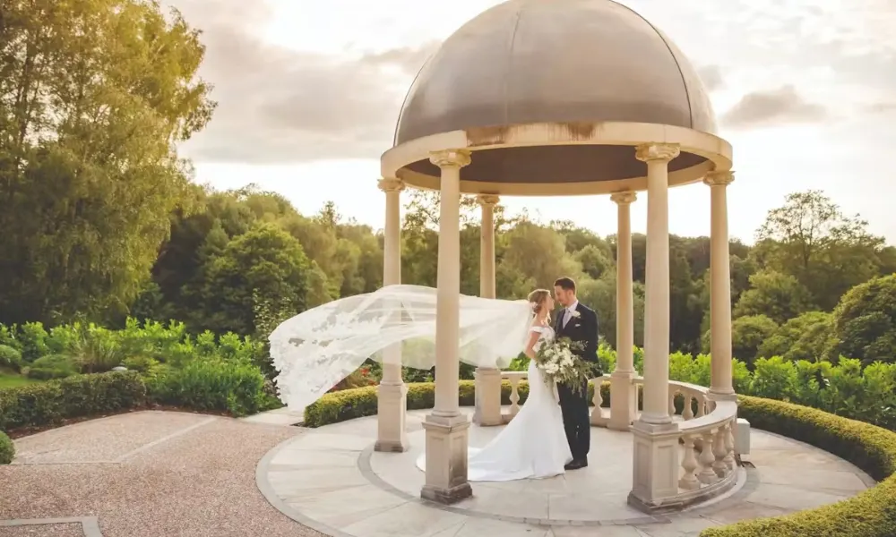 wedding couple under a gazebo
