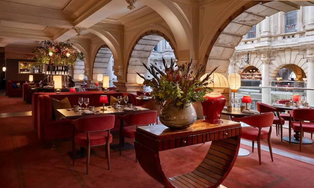 red mezzanine dining room with large arch windows