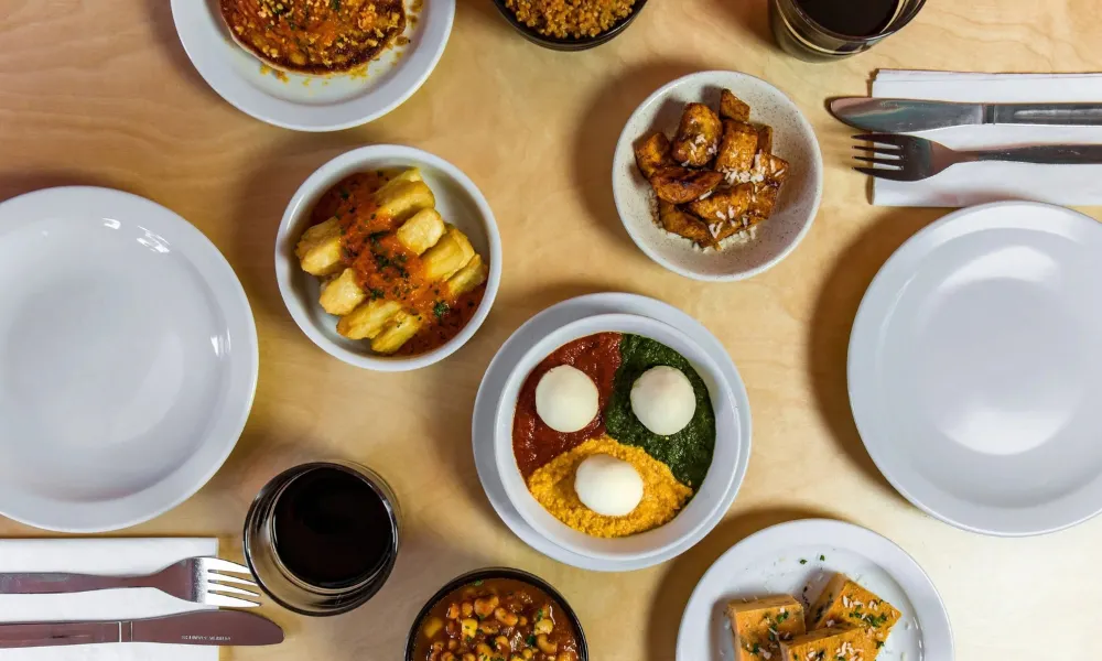 table with Nigerian tapas style dishes 