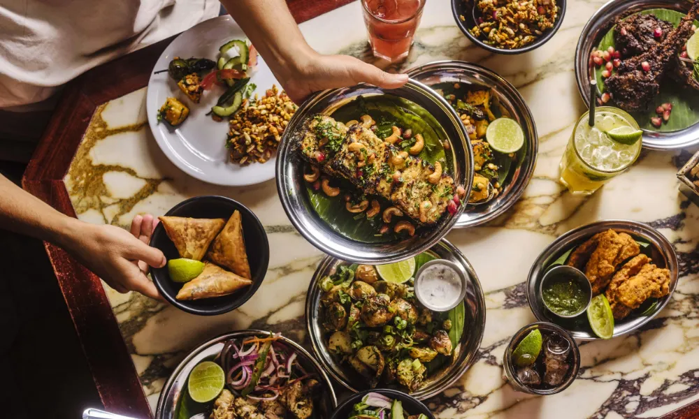 dishoom dishes and grills on a table