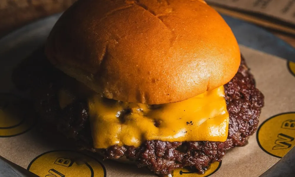 Smash burger close up with melty orange cheese