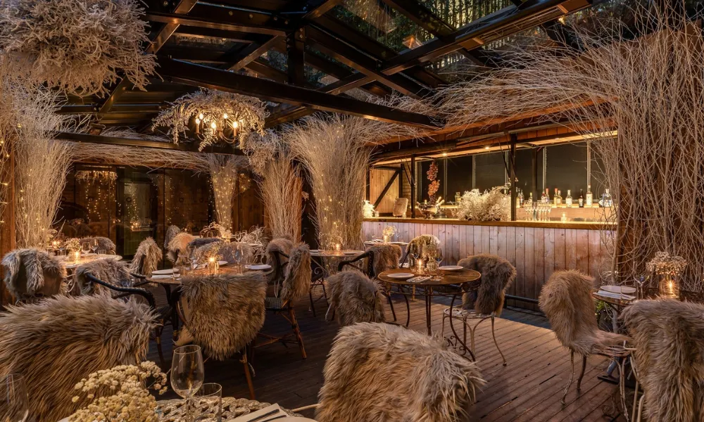 outdoor restaurant with fur throws and silver sticks