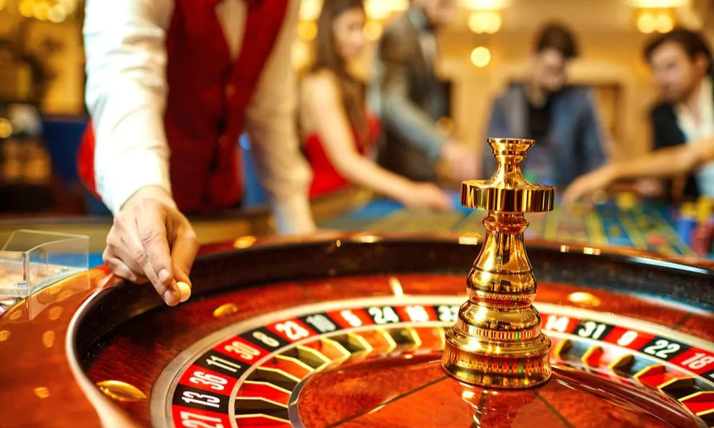 casino table with roulette wheel