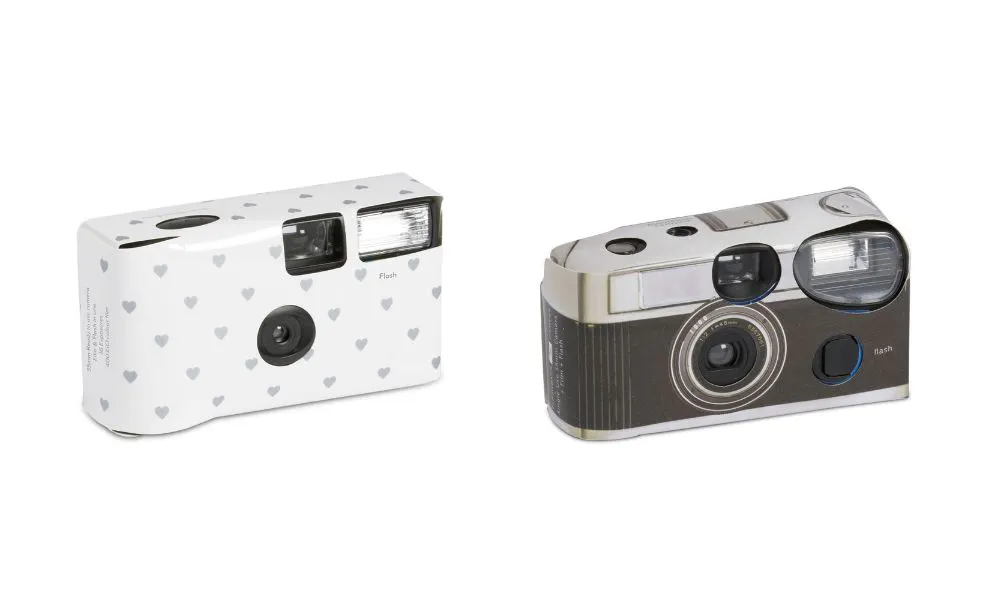 two disposable film cameras with cardboard cases