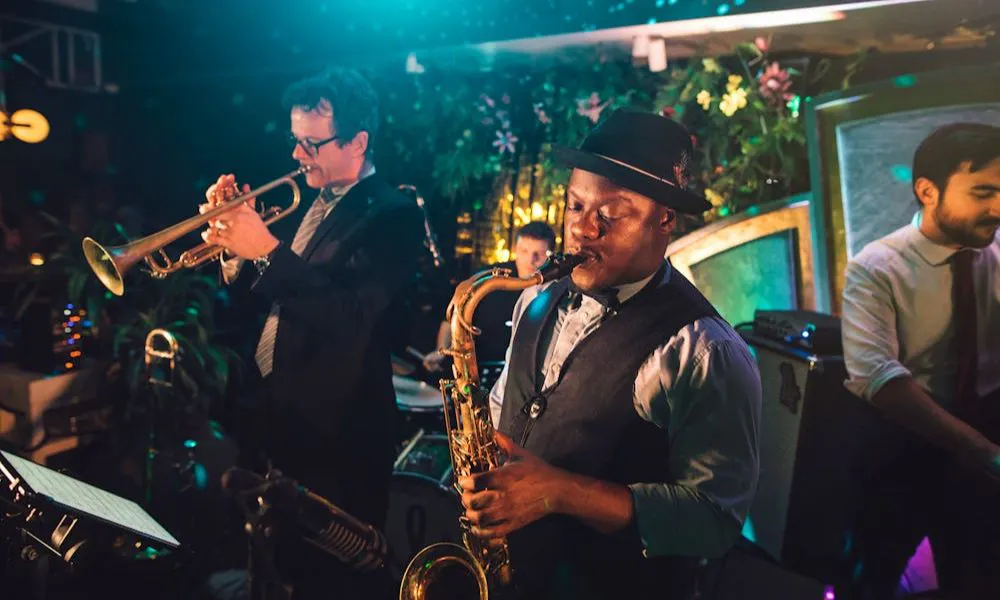 band plays trumpet and saxophone