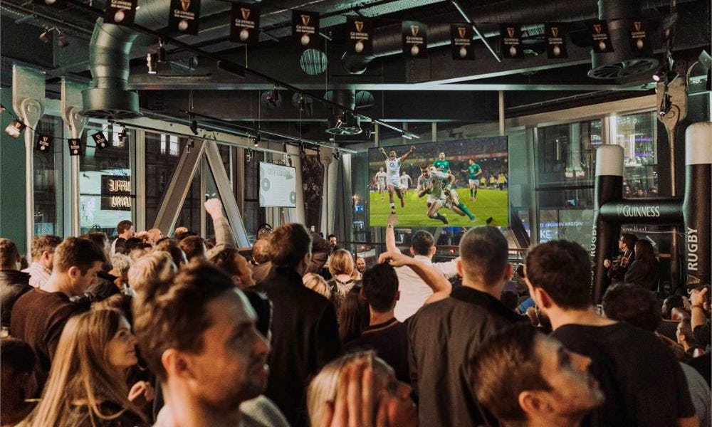 a crowd watching the rubgy at greenwood pub