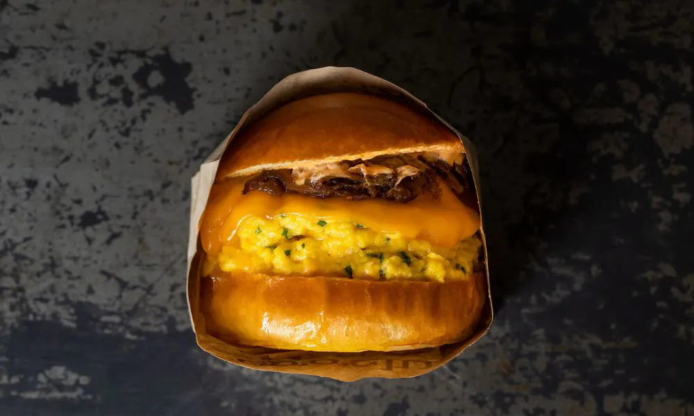Brioche burger bun with scrambled egg and cheese