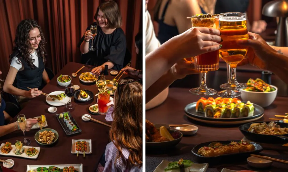 Women at a table drinking and eating sushi