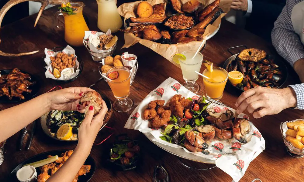 Sharing platters and drinks on table