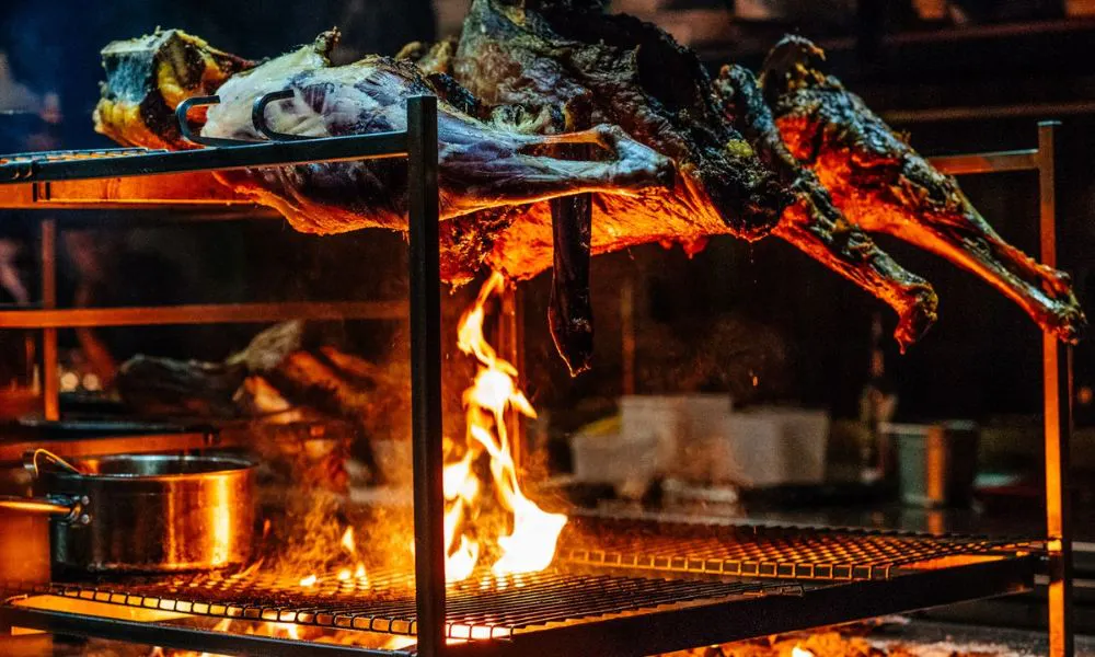 temper roasting lamb over fire