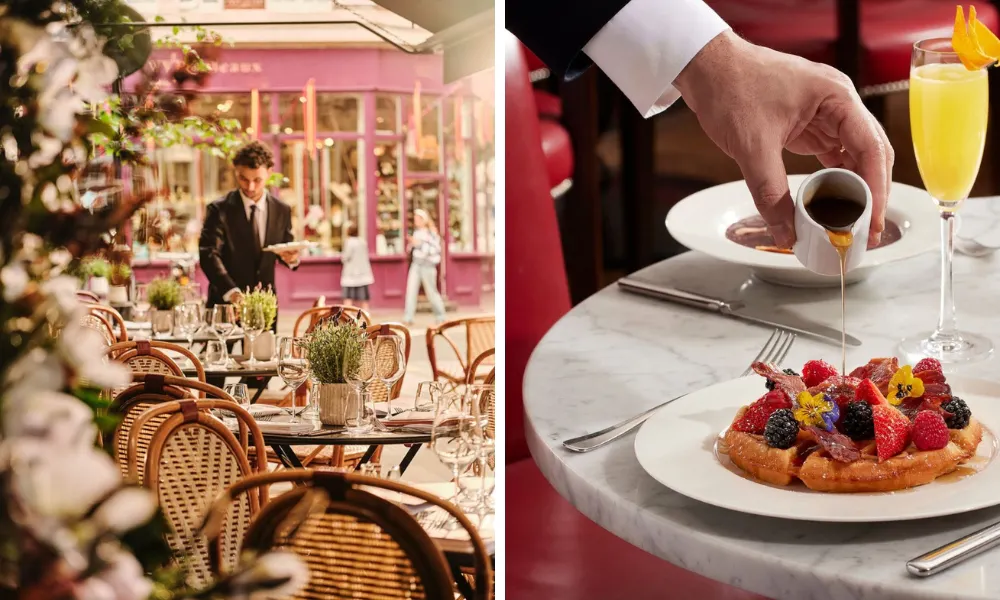 a waffle on a table topped with fresh berries, served with a mimosa and bloody mary