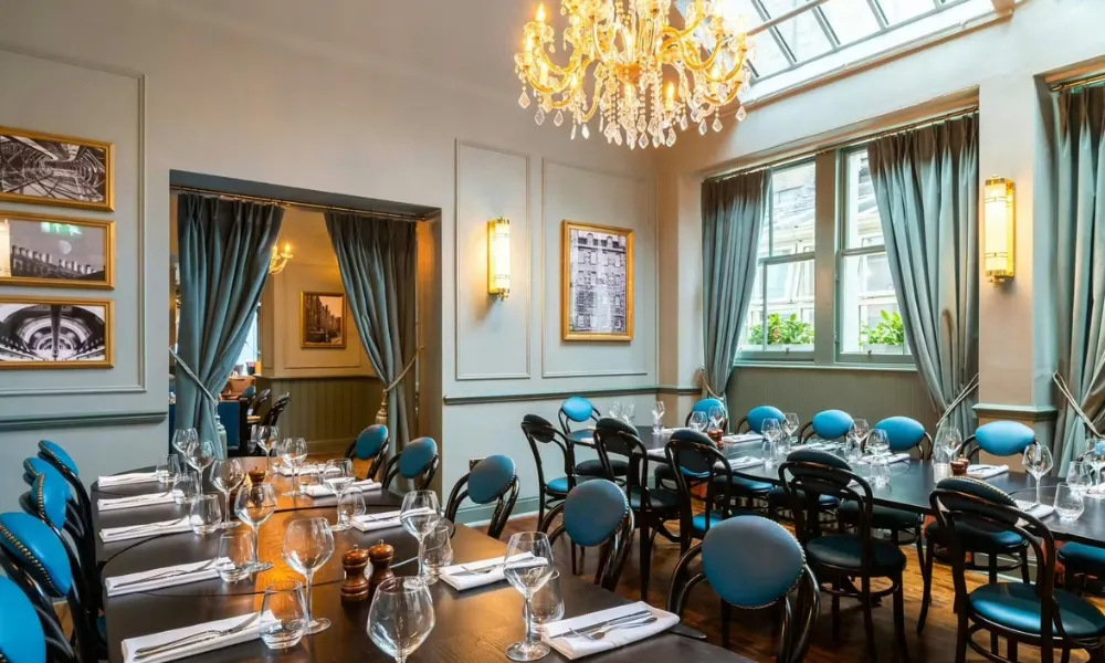 glam private dining room with chandelier