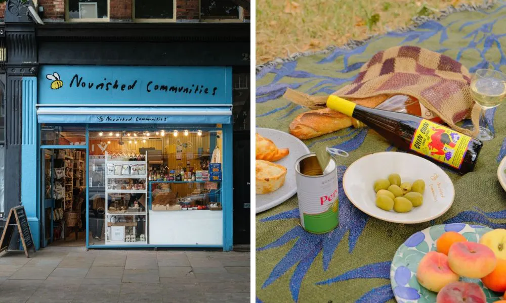 blue shop front and selection of wine grapes and olives on picnic blanket