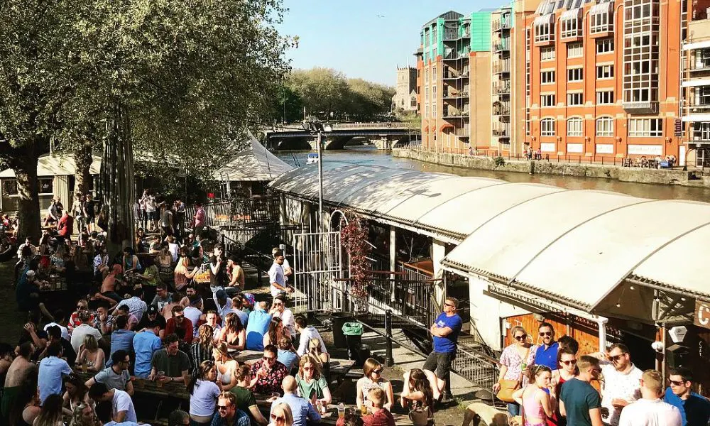 People drinking outside the apple