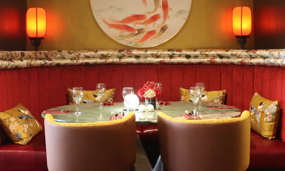 a cosy booth decked out with Chinese-inspired decor