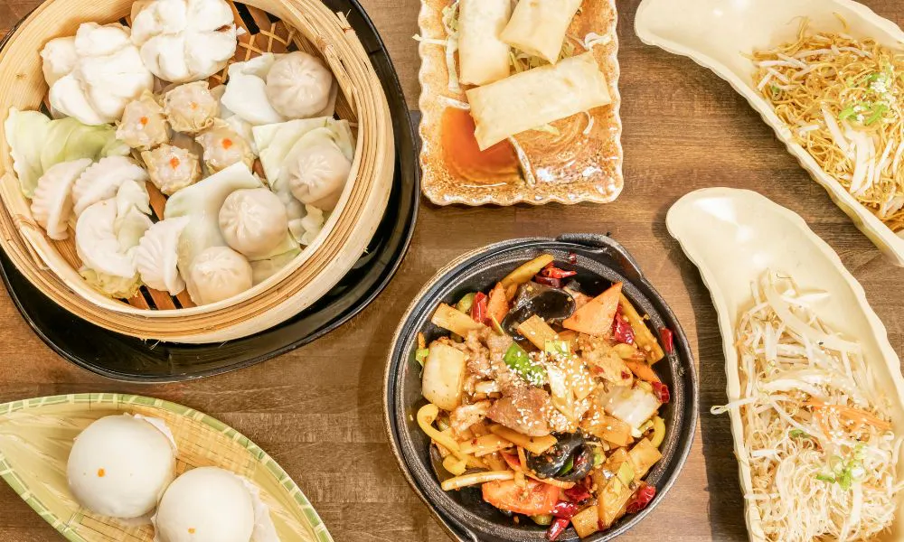 a birds eye view of a selection of Chinese cuisine on a table