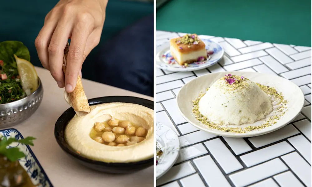 Hand scooping houmous with bread