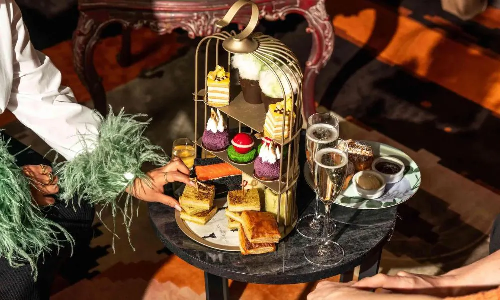 a colourful stand of afternoon tea cakes