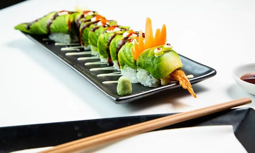 avocado sushi roll made to look like a dragon