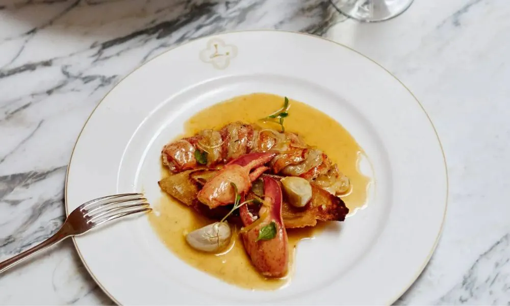 lobster claws and sliced lobster in a sauce