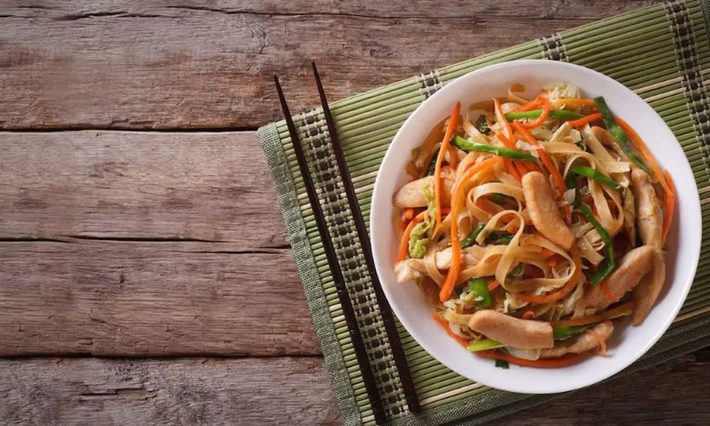 bowl of noodles and chopsticks