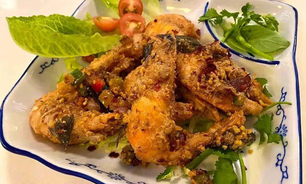 fried chicken on a bed of salad