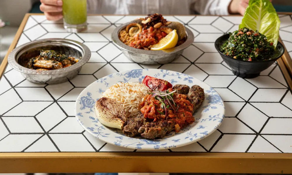 Tile table laid with lebanese main courses
