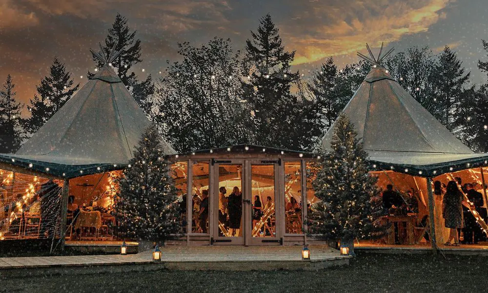 stretch tents decorated with Christmas trees and fairylights