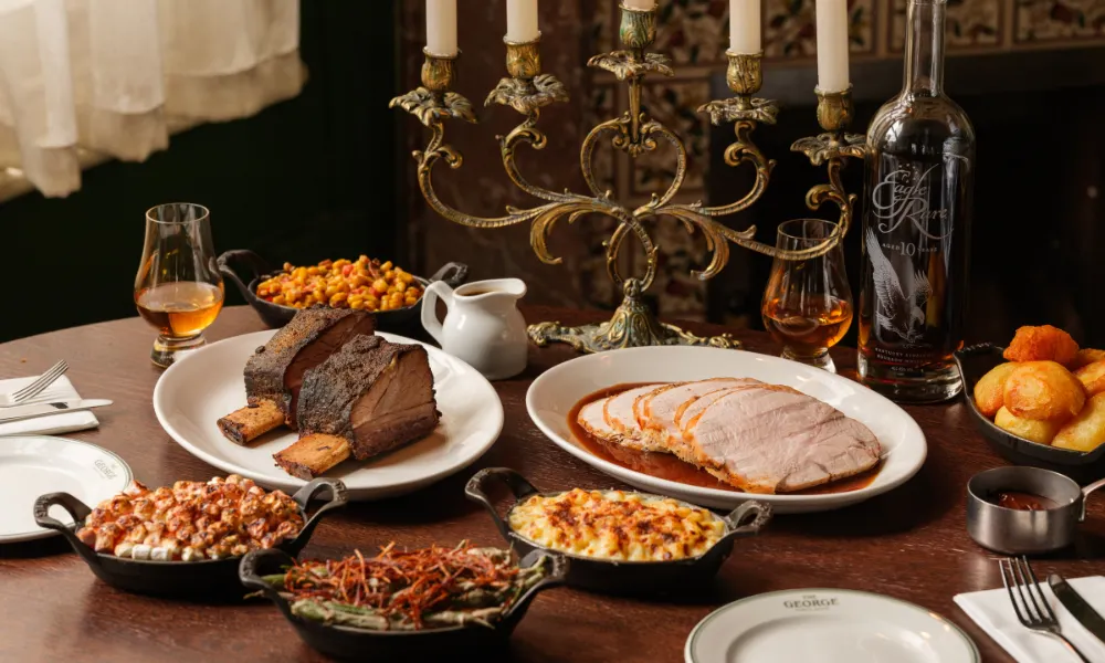 table decorated with candles and slices of turkey